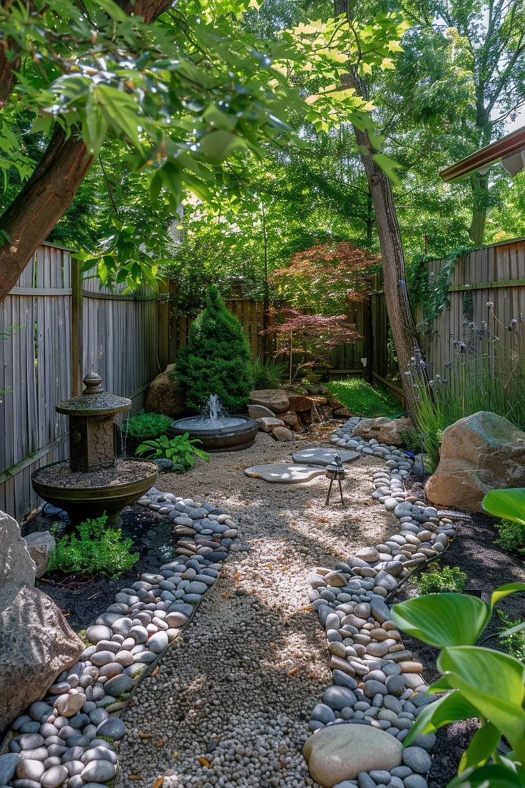 a garden with rocks and trees in it