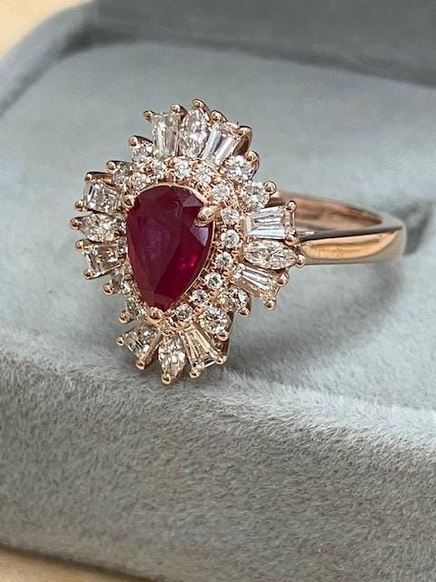 Gorgeous Ruby  , .67ct set in 14k Rose gold diamond ring filled with baguette, round and little Marquise cut diamonds. Diamonds weigh .76ct . Ring is 4.4 Grams in gold, size 5. Ruby and diamonds are 100% natural. Ruby is of highest quality. Diamonds are G+ / Vs2+. This is a very well made and well-balanced ring. Ruby Diamond Ring With Vvs Clarity And Baguette Cut, Baguette Cut Ruby Ring With Baguette Diamonds For Wedding, Rose Gold Ruby Ring With Brilliant Cut Diamond, Wedding Rings With Ruby And Baguette Diamonds, Rose Gold Diamond Ring With Rose Cut Baguette, Wedding Ruby Ring With Baguette Diamonds, Fine Jewelry Ruby Ring With Baguette Diamonds For Wedding, Anniversary Ruby Ring With Baguette Diamonds, Ruby Rings With Baguette Diamonds For Anniversary