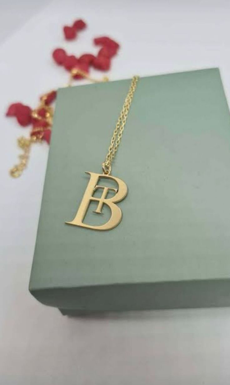 "celebrate your unique style? Look no further than this stunning 14K solid gold double letter name necklace! Crafted from premium-quality 14K gold, this minimalist initial necklace is the perfect way to show off your individuality and style. Whether you're looking to commemorate a special date, express your love for someone special, or simply add a touch of elegance to your everyday look, this customized couple jewelry is sure to impress. Featuring two delicate letters in a stylish cursive font, this personalized name necklace is a truly unique piece of jewelry. Whether you choose to wear it as a standalone piece or layer it with other necklaces for a more dramatic effect, it is guaranteed to make a statement. Perfect for gifting, this 14K solid gold double letter name necklace is an ideal Luxury 14k Gold Initial Necklace For Formal Occasions, Luxury Initial Pendant Name Necklace As Gift, Luxury Initial Pendant Name Necklace With Initials, Luxury Initial Pendant Name Necklace, Luxury Initial Pendant Necklace With Initials, Luxury Initial Pendant Necklace For Gift, Elegant Gold Initial Necklace With Name Detail, Elegant Gold Initial Necklace With Custom Name, Luxury Sterling Silver Initial Necklace With Monogram