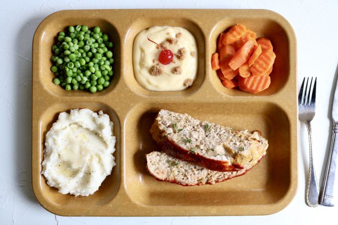 a plastic tray filled with different types of food