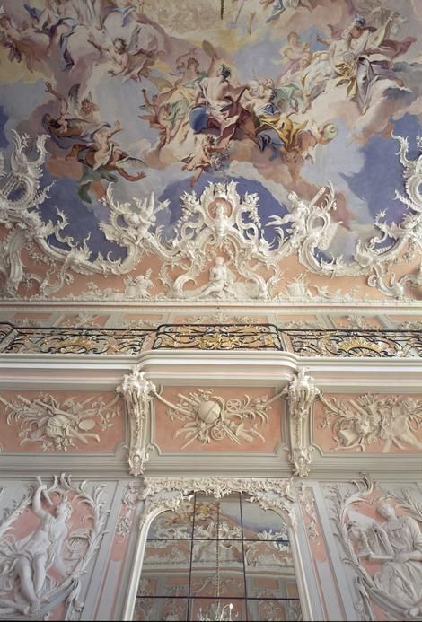 an ornately decorated ceiling in a building