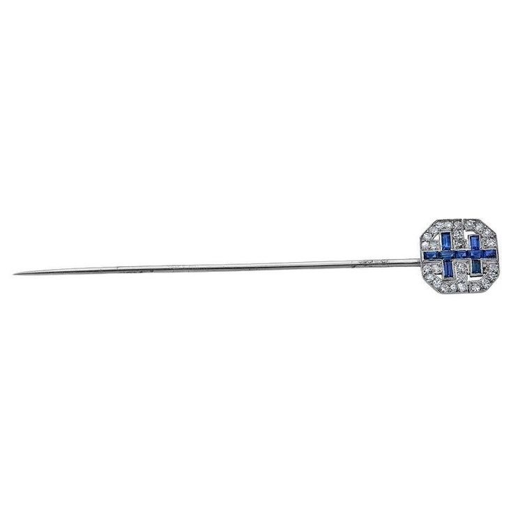 On of a Kind Stick Pin from the Early 20th century. The piece was crafted in 18k white gold featuring approximately 2.75 inches of pin for proper securing. The pave face of the pin features diamonds and sapphires in a double cross pattern. The face of the pin measures approximately 0.5 inches. A great piece for any lapel - men or women. La Face, Cross Patterns, Stick Pins, Early 20th Century, Black Diamond, French Antiques, 20th Century, The Face, Sapphire