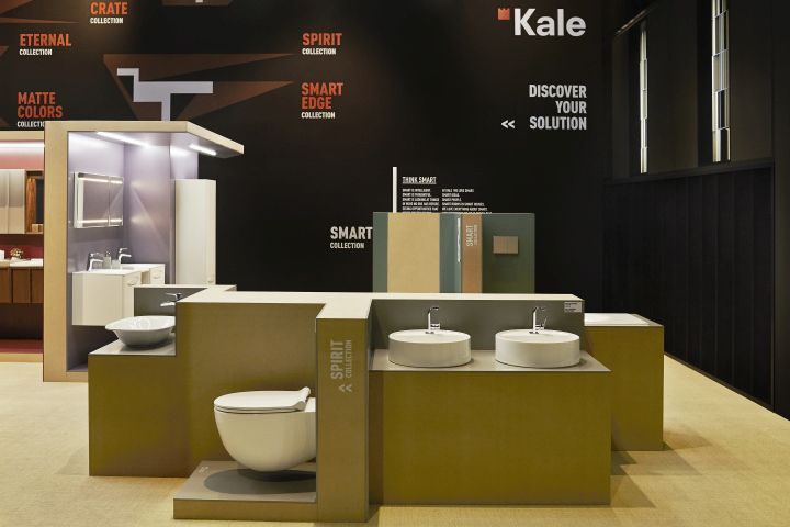 an exhibit room with two toilets and sinks