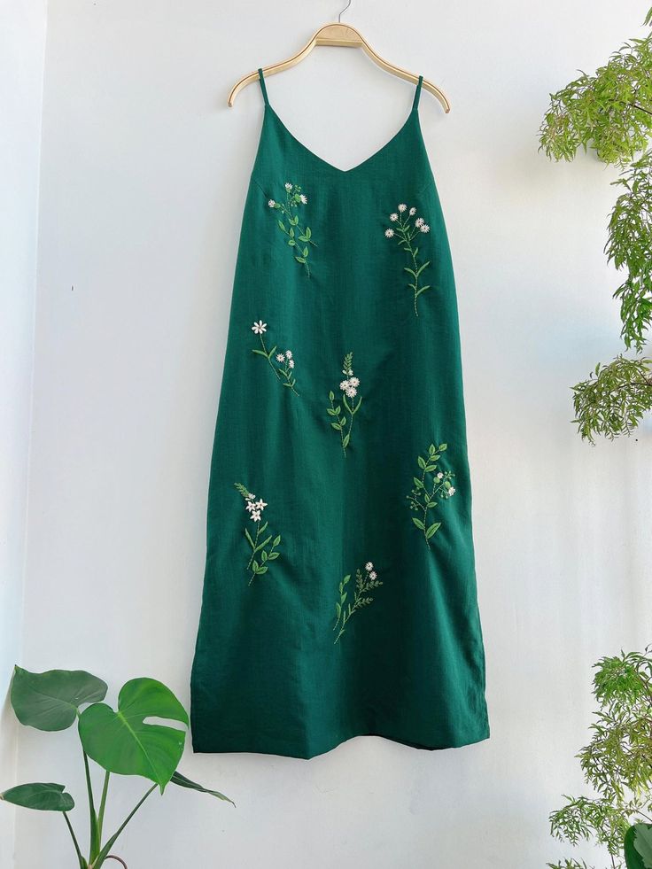 ❤ The hand embroidered linen dress is very soft, skin friendly, breezy and comfortable. ❤ Item description: - A lovely dress with embroidered flowers motifs. - Suitable for hot summer. - Material: linen, button, embroidery threads. - Environmentally friendly. - This dress is very useful, go with any outfit, that can be used to go out, go shopping... It is a perfect gift for yourself or your beloved. ❤ Care instructions: The best way to wash embroidery cloth is to put it in soapy water (with a mi Vacation Sundress With Floral Embroidery And Spaghetti Straps, Cotton Midi Dress With Floral Embroidery For Brunch, Floral Embroidered Sundress With Spaghetti Straps, Cotton Midi Dress With Floral Embroidery For Vacation, Linen Midi Dress With Floral Embroidery, Embroidered Linen Midi Dress, Embroidered Linen Midi Dress For Summer, Embroidered Sundress With Spaghetti Straps, Summer Embroidered Linen Midi Dress