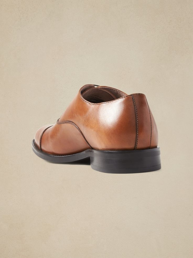 A clean and classic dress shoe with subtle cap-toe design, made in luxurious Italian leather.  Style with no-show socks and a smirk for an irreverent twist that's all confidence.  Flexible, leather or suede upper.  Designed with lightweight, durable Leather Cap, Dress Shoe, Leather Style, No Show Socks, Classic Dress, Toe Designs, Italian Leather, Cognac, Sale Items