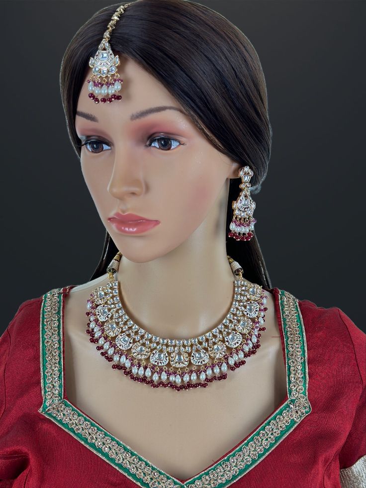 Bridal Ruby Red Fine Kundan Indian Bridal Necklace, Wedding necklace, Fine kundan jewelry, Pakistani Jewelry, Indian Jewelry, Bridal Jewelry Rose Gold-plated foiled Kundan necklace set.  Regular Size And Adjustable Ships from California, USA Delivery in 2-5 business days in the USA. Other designs can be found here https://www.etsy.com/listing/1381240765/premium-quality-gold-plated-silver?click_key=e1a9e46c1ba3dcb2d7ddeb00610b709b7497bd62%3A1381240765&click_sum=5b5797e9&ref=shop_home_active_511&pro=1&frs=1&sts=1 https://www.etsy.com/listing/1266279586/premium-quality-gold-plated-silver?click_key=ac3f9678a67e3cb7b0f157cdf3d63e11bd1206cf%3A1266279586&click_sum=258e6572&ref=shop_home_active_20&pro=1&frs=1&sts=1 https://www.etsy.com/listing/1269817669/emerald-gold-victorian-uncut-polki?ref=list Traditional Red Bridal Sets For Reception, Red Chandbali Bridal Necklace For Wedding, Red Bollywood Bridal Sets With Pallu, Bollywood Style Red Bridal Sets With Pallu, Festive Red Chandbali Bridal Set, Traditional Red Kundan Tikka, Red Ruby Bridal Necklace For Reception, Red Kundan Bridal Sets With Stone Work, Bollywood Bridal Set With Red Stone Work