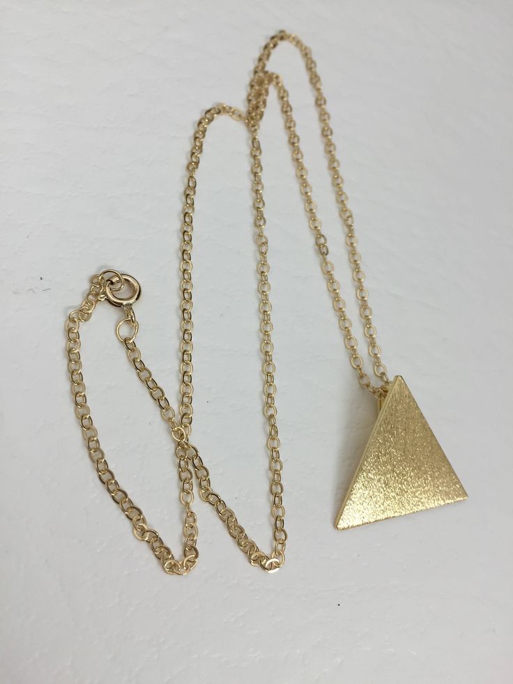 I've designed a Stevie Nicks inspired triangle pyramid pendant necklace like the one she wore in the Rumours era. It's one inch in diameter and I've made from solid sterling silver and then used a 24K gold plating so it has the look of gold, without nearly the same expense! The plating will last if you take care of the necklace, so be mindful not to sleep in it or wear it in the shower or swimming. The chain is gold-filled and will come with a lobster claw for secure attachment. You can choose y Gold Triangle Brass Jewelry, Gold Triangle Necklace For Gift, Pyramid Necklace, Stevie Nicks Style, Triangle Necklace, Crescent Moon Necklace, Stevie Nicks, Felt Bag, Curb Chain