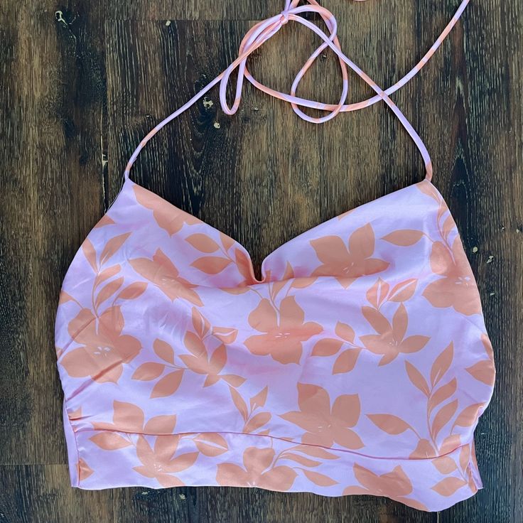 Backless Halter Top. Silky Material. Vibrant Orange And Pink Floral Pattern. Size 4/Small. Tts. Never Worn Pink Crop Top With Built-in Bra, Pink Tops With Built-in Bra For Day Out, Pink Cropped Crop Top With Built-in Bra, Chic Pink Crop Top Halter, Pink Summer Halter Top With Built-in Bra, Pink Halter Neck Crop Top For Spring, Pink Cropped Halter Top For Spring, Pink Triangle Top With Built-in Bra, Chic Pink Triangle Top