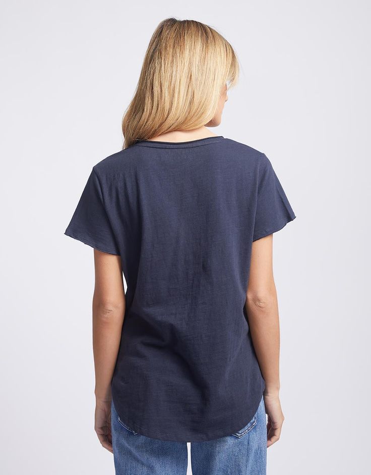 DESCRIPTION Have you been looking for the perfect everyday t-shirt? Look no further than the Original V-Neck T-shirt from White & Co. Designed to be the tee that you know you can reach for to look stylish and be comfortable! Crafted from ultra-soft cotton jersey, this stylish women's t-shirt features a v-neckline, short sleeves, and a flattering scoop hem. We are sure you will want one of these in every colour! Wear it with everything from jeans to skirts, this everyday essential is the perfect Navy Colour, Perfect Foundation, Look Stylish, Women Supporting Women, Navy Color, Quality Fashion, Stylish Women, Body Shapes, Fabric Care