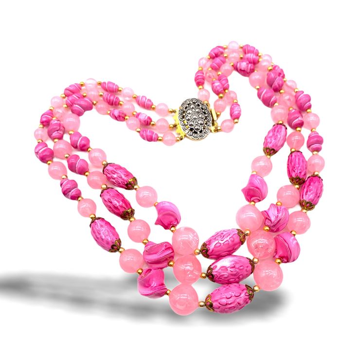 "Original 1960s necklace   Charming and enveloping,  vibrant color and beautiful Beads, many shades  and many forms for this necklace with three strands, in a cascaded design a jewel  perfect to brighten your day, very feminine and retro The strands cascade to 14\", 16\" and 18\" and it is finished by a lovely  ornate push clasp, in  silver/gold tone  with small cabochons imitation marcasite  In mint condition Shipping from Italy to the rest of the world: please note that shipping costs are rela Vintage Multi-strand Gemstone Beads Necklace, Vintage Multi-strand Gemstone Bead Necklaces, Elegant Pink Beads For Gift, Pink Polished Bead Necklace For Gift, Pink Polished Beaded Necklaces For Gifts, Elegant Pink Beads As Gift, Elegant Pink Polished Beads, Pink Necklace With Polished Beads For Gift, Pink Necklaces With Polished Beads For Gifts