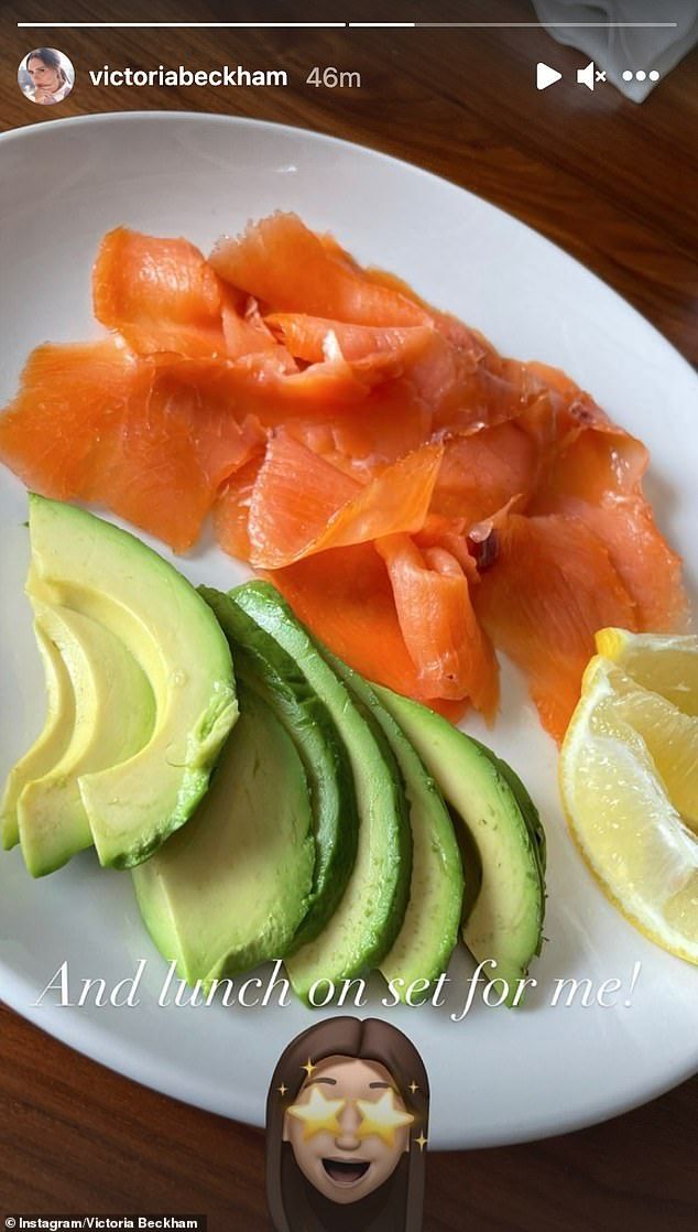 the plate has salmon, avocado and lemon slices on it with an emoticive smiley face