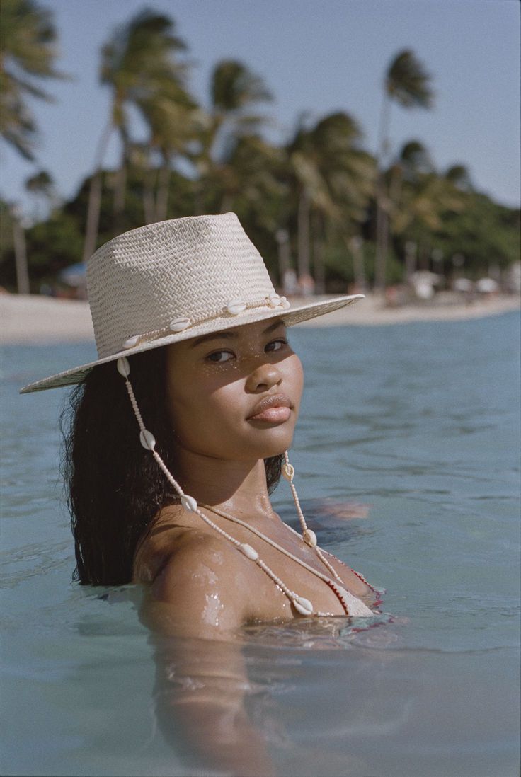 Get ready, your holiday adventure awaits… The destination of your dreams is only minutes away with our straw woven fedora. Featuring a decorative chin strap and finished with beads and seashells, this is the ultimate seaside accessory. --- Image from @biancakeii White Wide Brim Fedora For Beach, Cream Toquilla Straw Hat Bands For Vacation, Cream Toquilla Straw Hat For Vacation, White Fedora For Beach With Short Brim, White Beach Fedora With Short Brim, White Straw Fedora For Beach Season, Adjustable White Straw Fedora, Adjustable White Straw Hat For Poolside, Adjustable Beachwear Panama Hat For Vacation