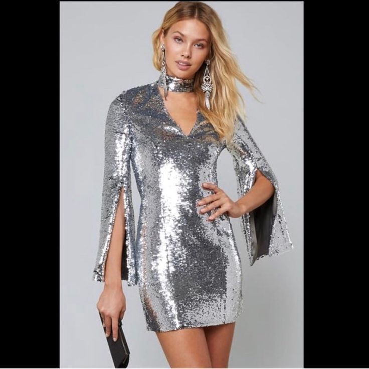 Bebe Sequin Long Sleeve Dress Silver M Rare New Size Medium New With Tags Silver V-neck Sequin Party Dress, Long Sleeve Silver Sequined Mini Dress, Silver Fitted Sequin Dress Glamorous, Silver Fitted Sequin Dress For Glamorous Look, Silver Long Sleeve Sequined Dress, Fitted Silver Sequin Glamorous Dress, Silver Fitted Glamorous Sequin Dress, Metallic Sequin Dress For Evening, Metallic Shiny Sequin Dress For Evening