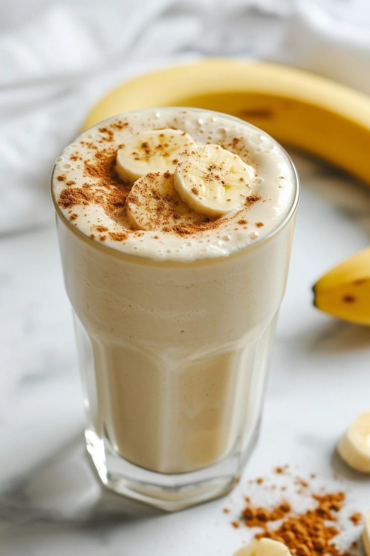 there is a drink with bananas on the table