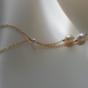 Elegant Double Strand Backdrop Necklace With Delicate Chain, Elegant Long Necklaces For Weddings, Single Strand Long Necklace For Wedding, Classic Long Necklace For Weddings, Delicate Single Strand Necklace For Anniversary, Elegant Pearl Charm Dangle Lariat Necklace, Delicate Single Strand Bridal Necklace, Elegant Adjustable Necklace For Anniversary, Elegant Single Strand Long Drop Necklace