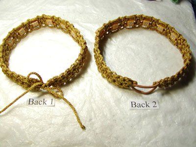 two bracelets that are sitting on top of a white cloth covered surface, one has a string and the other has beads