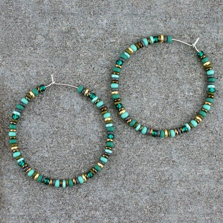 "Handmade, beaded, boho hoop earrings. * DETAILS: ‣ various Czech and Japanese glass seed beads ‣ colors: turquoise, pine green, bronze, gold, olive, grey ‣ carefully handmade, polished earring hoops (316L grade stainless steel) * SIZE: ‣ approx Ø: 1.7\" / 4.3 cm ‣ size of the beads: 3 mm Click here for more beaded hoop earrings: www.etsy.com/shop/LianuDesign?ref=seller-platform-mcnav%C2%A7ion_id%C2%A7ion_id§ion_id=26956662 Or check out all items in the shop: www.etsy.com/shop/LianuDesign" Turquoise Hoop Earrings With Dangling Beads, Adjustable Turquoise Hoop Earrings With Colorful Beads, Bohemian Heishi Beads Hoop Earrings, Bohemian Heishi Beads Hoop Earrings As Gift, Turquoise Beaded Hoop Earrings, Turquoise Hoop Earrings With Colorful Beads, Green Beaded Hoop Earrings For Beach, Bohemian Adjustable Hoop Earrings With Spacer Beads, Turquoise Hoop Earrings With Colorful Beads For Beach