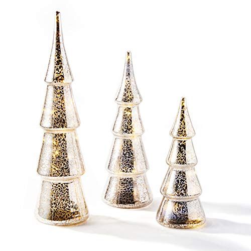 three glass christmas trees with gold glitter on the top and bottom, standing in front of a white background