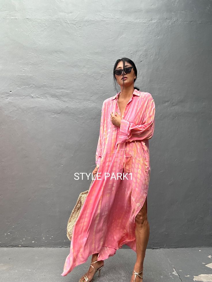 Jimbaran dress  is an oversized long sleeve soft rayon voile Long shirts  dress  .  This Oversized shirt dress is designed to flatter every body type and fit numerous occasions. 👍Included tali - f e a t u r e s - - Relaxed fit - Front pockets Fabric: 100% Soft rayon voile  Style:oversized fit Color:Bali  tie dyed peach & multi motif Wash :Hand cool wash  - measurement -  - One size  -  I recommend American size M to XL Chest /164cm/ 64inch(round) Length/135cm/53inch Transparent - it's  transpar Spring Long Sleeve Relaxed Fit Kaftan, Oversized Summer Shirt Dress For Vacation, Oversized Shirt Dress For Summer Vacation, Oversized Summer Vacation Shirt Dress, Casual Long Sleeve Maxi Dress In Free Size, Casual Long Sleeve Maxi Dress For Beach Season, Casual Long Sleeve Free Size Maxi Dress, Casual Flowy Long Sleeve Beach Dress, Oversized Long Sleeve Tunic For Beach Cover-up