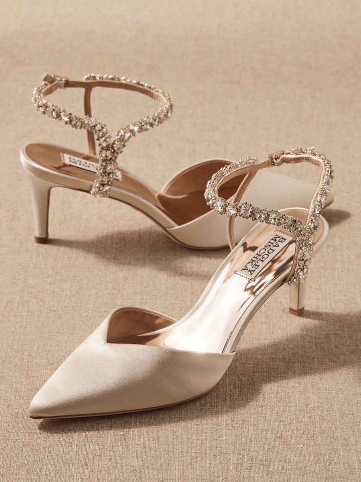 a pair of women's wedding shoes with jeweled straps