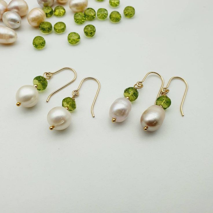 Pearl earrings gold,Periodot earrings gold filled,14 ct goldfilled earrings, peridot pearls,Gemstone earrings,minimalist pearls earrings  Beautiful earrings made of fresh water  Pearl and peridot with 14ct goldfilled Beautiful design and an elegant contrast of white and green. Size: 8 mm pearl with 6mm Green Drop Earrings, Elegant Hypoallergenic Green Jewelry, Elegant Green Hypoallergenic Jewelry, Elegant Peridot Round Beads Jewelry, Hypoallergenic 14k Gold Green Jewelry, Hypoallergenic Green 14k Gold Jewelry, Yellow Gold Hypoallergenic Jewelry With Briolette Shape, 14k Gold-filled Pear-shaped Pearl Drop Jewelry, 14k Gold Filled Pear-shaped Pearl Drop Jewelry