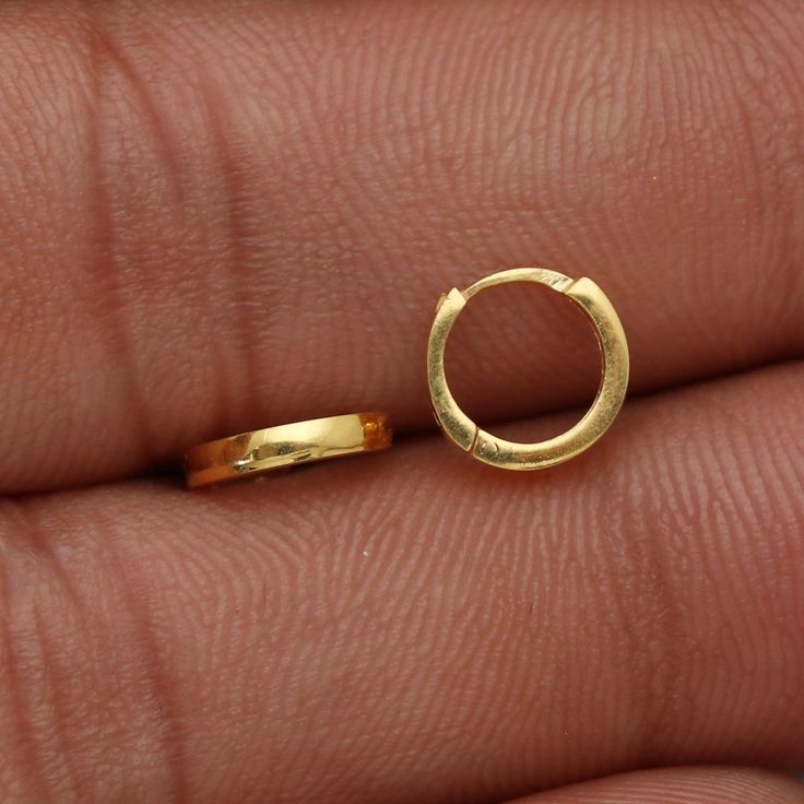 20kt 20 karat small hoop cartilage yellow gold Hoop Bali earrings  Gold Purity- 20k yellow Gold Weight - 0.47 grams approx Full Length - 0.8 cm approx Full Width - 0.8 cm approx click to see similar  https://www.etsy.com/in-en/shop/morvijewels?ref=seller-platform-mcnav Click here  https://morvijewels.etsy.com/    to get more discount and offers Happy to take wholesale bulk orders.