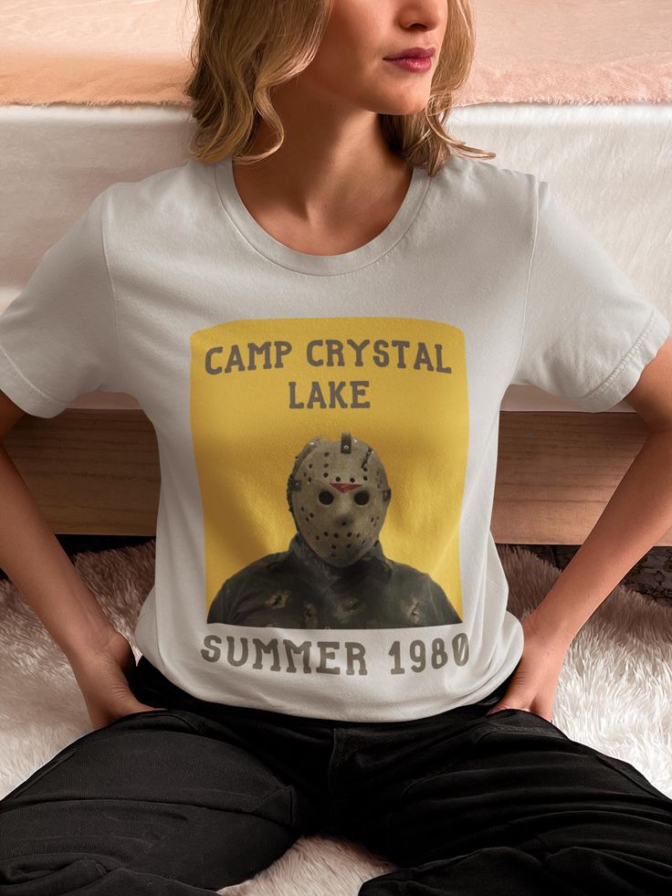 Friday The 13th Jason Camp Crystal Lake Tshirt - Vintage Halloween Jason Voorhees, Friday The Thirteenth Camp Crystal Lake Shirt PREMIUM QUALITY SHIRTS: Our classic unisex jersey short sleeve tee fits like a well-loved favorite. Soft cotton and quality print make users fall in love with it over and over again. These t-shirts have-ribbed knit collars to bolster shaping. The shoulders are tapered for a better fit over time. Dual side seams hold the garment's shape for longer.  SHIRT SPECS:  -Crafted from 100% Airlume combed and ring-spun cotton for lightweight, breathable layering. -The retail fit that is perfect for casual and semi-formal settings. The crew neckline adds a classic, neat style that's perfect for accessorizing. -The tear-away label minimizes skin irritations. -Runs true to si Jason Camp Crystal Lake, Camp Crystal Lake Shirt, Lake Tshirt, Friday The Thirteenth, Halloween Jason, Friday The 13th Jason, Camp Crystal Lake, Jason Voorhees, Crystal Lake