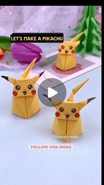 three origami pikachu are standing next to each other