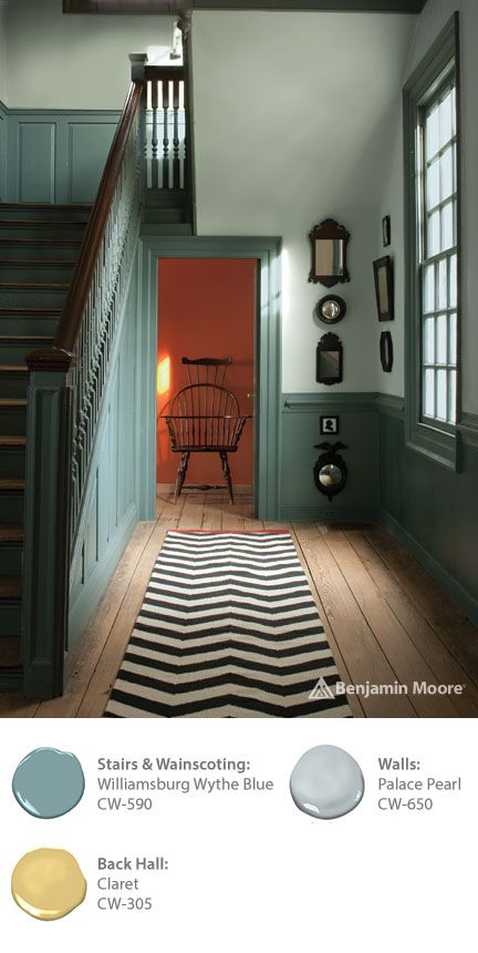 a room with stairs and a rug on the floor