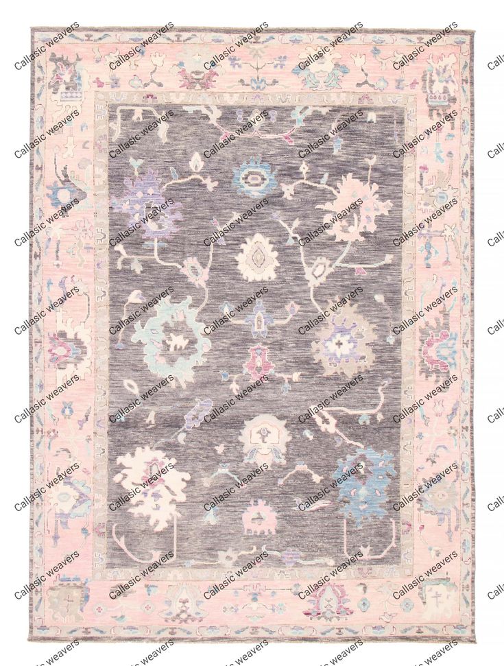 a gray rug with pink and blue flowers on the bottom, in front of a white background