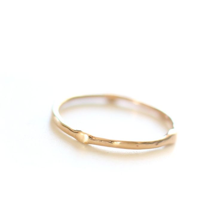 Introducing the original Dainty Ring - a must-have for every ring stack! Made from 14k yellow gold, this ring is both delicate and chic. Wear it alone for a minimalist look or stack it up to create a personalized set. Handcrafted with care, each ring is unique, showcasing its own rustic character. Measuring 1mm in width, this ring is the perfect addition to your jewelry collection. • Please note that Amy will need two weeks to create your ring with utmost attention to detail. Everyday Tiny Stackable Rings In 14k Gold, Dainty 14k Gold Toe Ring, Dainty Stackable Rings In Recycled Gold For Promise, Dainty Recycled Gold Stackable Rings For Promise, Dainty Stackable Promise Rings In Recycled Gold, Dainty Everyday Stackable Rings In Recycled Gold, Delicate Everyday Stackable 14k Gold Rings, Adjustable Yellow Gold Stackable Rings With Simple Design, Dainty 14k Gold Stackable Rings