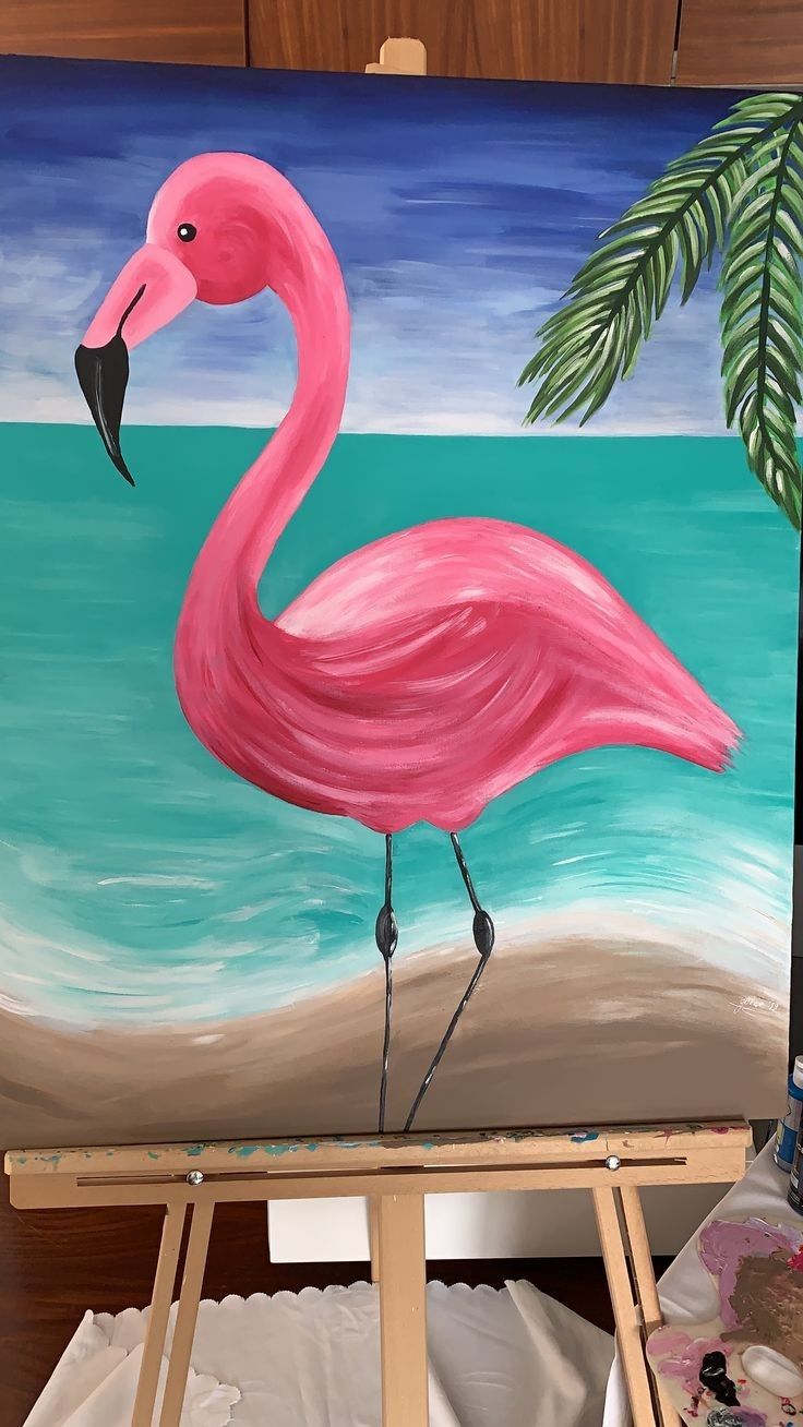 a painting of a pink flamingo on an easel