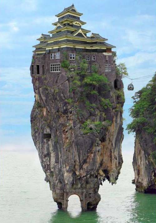 an island in the middle of the ocean with a castle on it's head