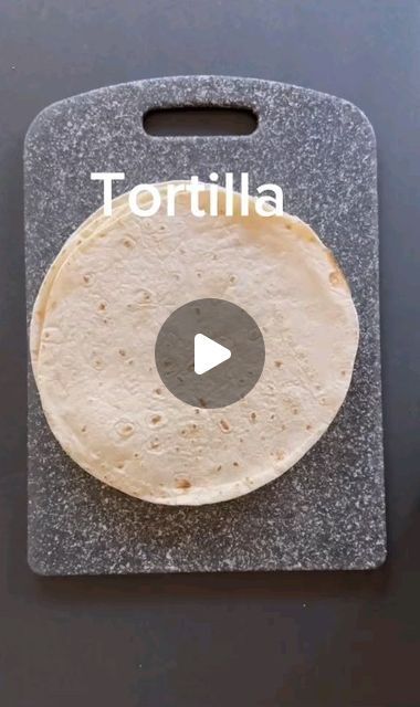 a tortilla sitting on top of a black counter