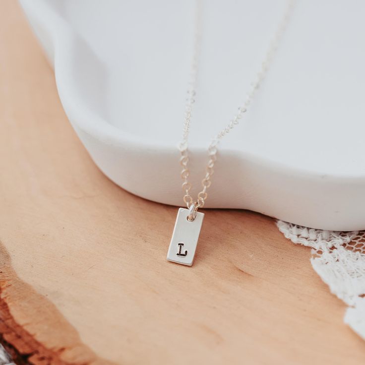 Initial Tiny Rectangle Tag Necklace-Rockaway Gypsea Minimalist Nickel-free Initial Pendant Charm Necklace, Simple Personalized Charm Necklace As Gift For Her, Dainty Stamped Charm Necklaces For Everyday, Minimalist Personalized Necklace For Everyday Use, Minimalist Rectangular Necklaces As Gift For Her, Minimalist Rectangular Necklace As Gift For Her, Minimalist Nickel Free Charm Necklaces For Everyday, Minimalist Nickel-free Charm Necklaces For Everyday, Personalized Minimalist Charm Necklaces For Her