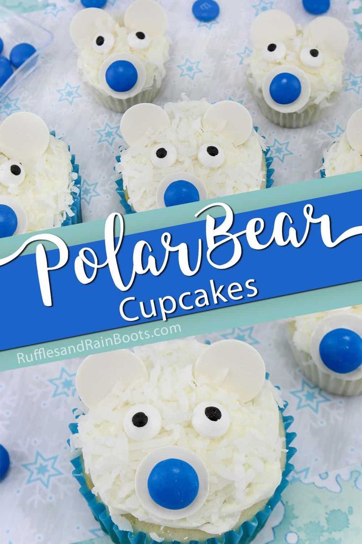 cupcakes with white frosting and blue icing are decorated like polar bears