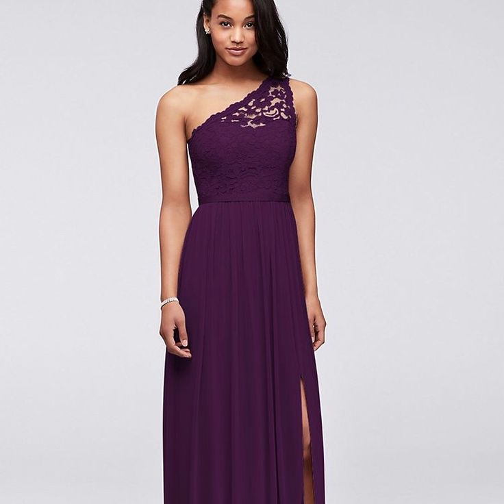 a woman in a long purple dress with one shoulder and lace detailing on the top