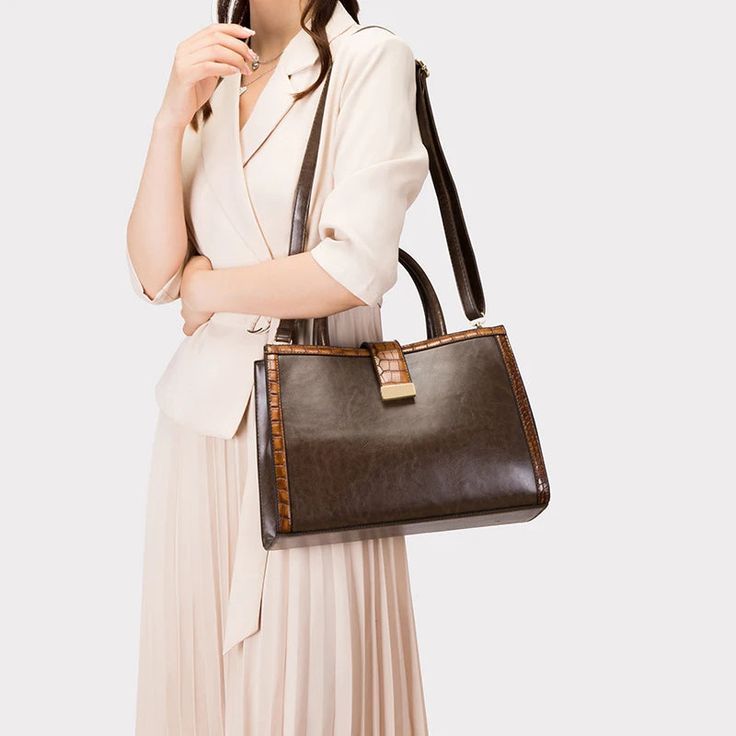 This Retro Women's Shoulder Crossbody Bag offers a stylish and versatile option for carrying your essentials. Crafted from high-quality vegan leather, it exudes a touch of retro charm. The new portable three-piece set is perfect for any occasion, making it a must-have for fashion-conscious individuals. Add a touch of European and American flair to your wardrobe with this versatile bag. Stylish and versatile shoulder crossbody bag crafted from high-quality vegan leather Exudes retro charm with its design, adding a unique touch to your ensemble Portable three-piece set offers functionality for various occasions Ideal accessory for fashion-conscious individuals seeking a blend of style and practicality Infuses a hint of European and American flair to elevate your wardrobe aesthetics Product S Office Burgundy Shoulder Bag With Gold-tone Hardware, Leather Shoulder Bag With Gold-tone Hardware, Rectangular Case, Burgundy Crossbody Bag With Zipper Closure, Burgundy Crossbody Shoulder Bag With Gold-tone Hardware, Red Crossbody Bag With Gold-tone Hardware, Retro Women, Chest Bag, Clutch Wallet, Three Piece