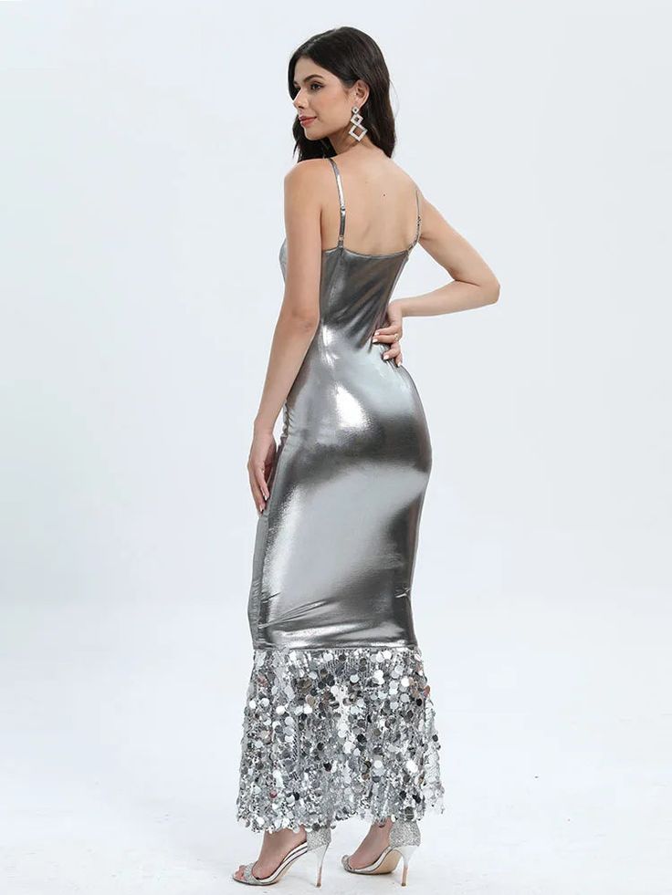 Introducing our captivating Silver Patchwork Sequin Maxi Dress, a stunning masterpiece that combines elegance with a touch of allure. This dress is designed to make you stand out at any event, whether it's a glamorous party, wedding, evening soiree, cocktail affair, or a red carpet event. Crafted with meticulous attention to detail, this dress offers a host of exceptional features. The breathable and sustainable polyester fabric ensures comfort, while its slight stretch provides just the right amount of flexibility for ease of movement. The spaghetti strap sleeve style adds a delicate and sophisticated touch, allowing you to showcase your shoulders gracefully. The slim fit silhouette accentuates your curves, and the ankle-length design adds a touch of drama and flair to your look. The squa Elegant Sequin Prom Dress With Fitted Bodice, Elegant Sleeveless Evening Sequin Dress, Glamorous Gala Dresses For Prom, Glamorous Champagne Evening Dress, Evening Gala Mermaid Maxi Dress, Sleeveless Bodycon Dress For Gala Party Season, Sleeveless Fitted Mermaid Party Dress, Elegant Evening Bodycon Prom Dress, Chic Evening Mermaid Dress For Prom Season