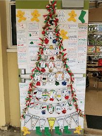 a christmas tree made out of magnets on a bulletin board in front of a classroom