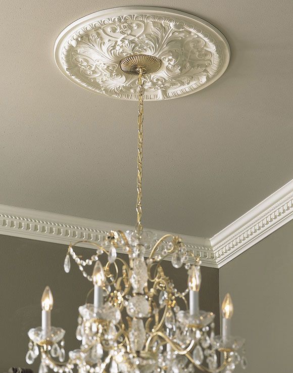 a chandelier hanging from the ceiling in a room