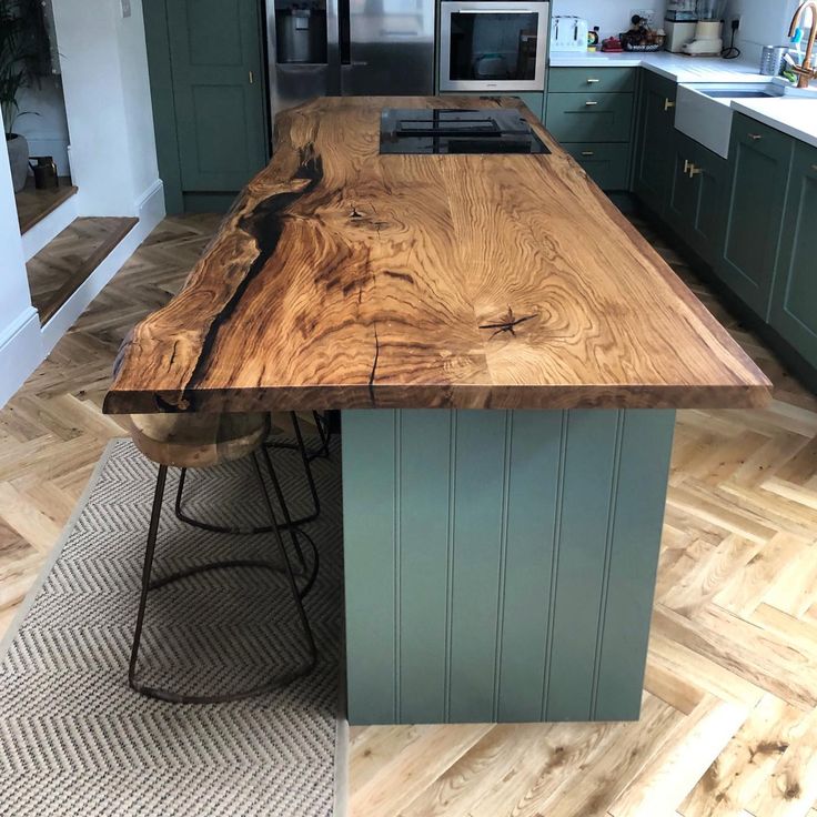 a kitchen island made out of wood and metal