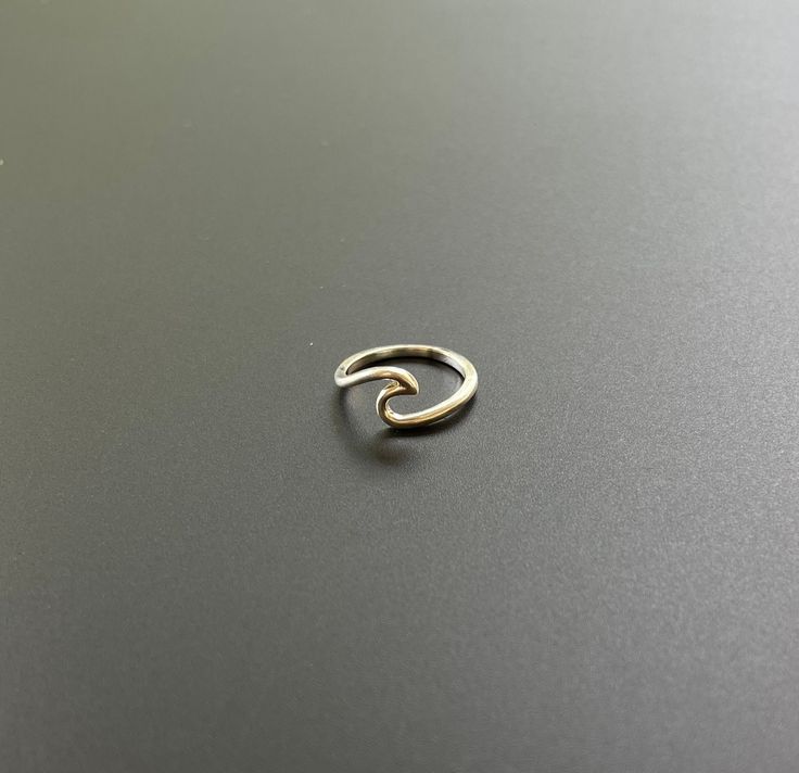 These elegant silver wave design ring are handcrafted from high-quality sterling silver, a minimalist and ocean-inspired aesthetic. Perfect for everyday wear, the smooth, flowing wave design adds a subtle touch of sophistication to any outfit. Lightweight and comfortable, these ring are an ideal choice for those who appreciate timeless, nature-inspired jewelry with a modern twist, Perfect for gifting. Minimalist Sterling Silver Wavy Ring, Inspired Aesthetic, Ocean Inspired, Nature Inspired Jewelry, Wave Design, Inspired Jewelry, Elegant Ring, Ocean Inspiration, Minimalist Jewelry