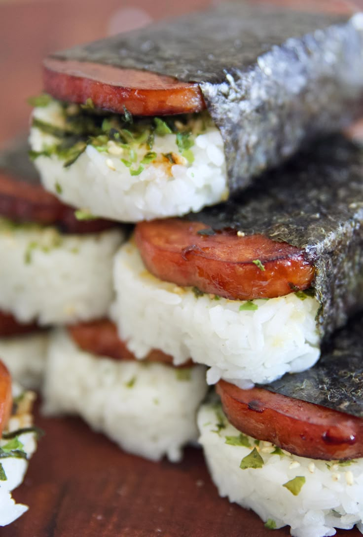 several sushi rolls stacked on top of each other