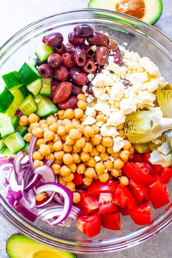 the ingredients for this salad are in a glass bowl, ready to be mixed together