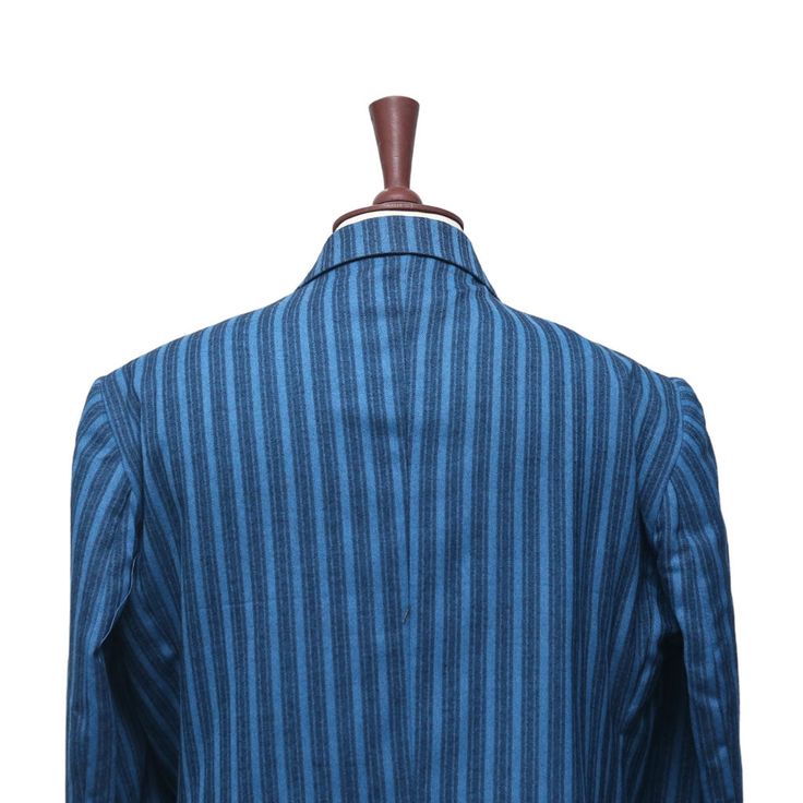 This Chiragh Apparel blazer is an elegant upgrade on dapper tailoring and features rich shades in a sumptuous fabric for elegant opulence. Fashioned from premium quality wool, this striped blazer features full lining in Japanese silk, a notch lapel, two-button closure and single-vented back. A left chest pocket and three flap pockets appoint the front while the inside has two (2) pockets on the left and one (1) pocket on the right. A flash of contrast piping is added to the jacket lining inside. Blue Sport Coat With Lapel Collar For Office, Tailored Blue Sport Coat With Single Button, Tailored Single Button Blue Sport Coat, Blue Lapel Collar Sport Coat For Work, Blue Fitted Blazer With Notch Lapel, Blue Single Button Sport Coat With Lapel Collar, Blue Semi-formal Sport Coat With Lapel Collar, Blue Sport Coat With Lapel Collar For Work, Blue Long Sleeve Suit With Buttons