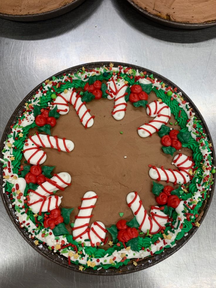 a cake decorated with candy canes and decorations