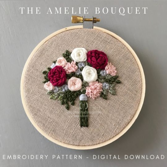 the embroidery pattern is being displayed in front of a gray background with text that reads, the amelie bouquet