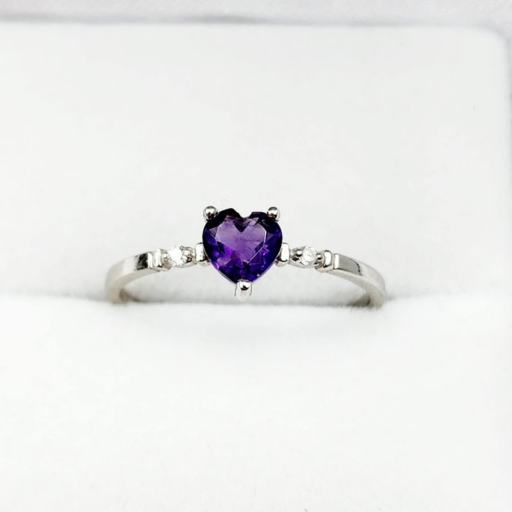 10K White Gold Ring Heart Shape Amethyst 0.31ct Size of stone: 5x5mm Two Diamonds 0.02ct Made in Canada * Comes in a Beautiful Gift Box, Perfect for Gifting * This ring is available in yellow gold and several gemstone selections. Please message me if you need any further information. ------------------------------------------------ * Please click here to visit my shop: https://www.etsy.com/shop/bestjewelryset * To see more rings please check out the link below: https://www.etsy.com/shop/BestJewe Heart Cut Amethyst Birthstone Jewelry, Diamond Heart Cut Birthstone Ring, Heart Cut Amethyst Ring With Accent Stones, Heart Cut Amethyst Jewelry With Center Stone, Amethyst Heart Ring For Valentine's Day, Fine Jewelry Amethyst Ring Heart Cut, Fine Jewelry Heart Cut Amethyst Ring, Heart Cut Amethyst Ring With Accent Stones For Anniversary, Amethyst Heart Cut Ring For Anniversary