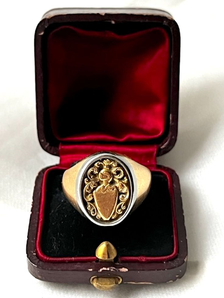 Beautiful Antique Italian 18k Yellow Gold & Platinum Family Crest Signet Ring. This ring is so beautiful and unusual, with a halo of platinum around the yellow gold setting to give more contrast to the finely engraved engraved crest. It was made at the beginning of Twentieth century. It is hallmarked 750 for gold purity (18k gold). The top part measured 16 by 11 mm.  US size: 7 3/4 (it can be resized upon request) Weight: 12.10 grams Good antique conditions. Thank you for visiting Boudoir Vintage!   Please feel free to contact me for further information or photos.  I offer international shipping. Your item will be packed with extreme care and will be shipped within 3-5 working days. If you are dissatisfied with your item, please feel free to contact me and would be happy to assist.  If you Luxury Engraved Signet Ring Collectible, Formal Oval Hallmarked Signet Ring, Classic White Gold Signet Ring For Ceremonial Occasions, Oval Hallmarked Signet Ring For Formal Occasions, Hallmarked Yellow Gold Engraved Collectible Ring, Timeless Hallmarked Signet Ring For Collectors, Timeless Hallmarked Signet Ring Collectible, Timeless Hallmarked Collectible Signet Ring, Luxury Gold Engraved Ring With Hallmarks